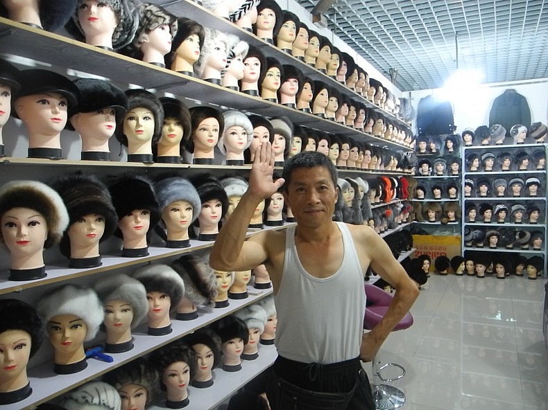 A Chinese merchant who sells fur wigs in the Horgos free trade zone. Photo by Wade Shepard.